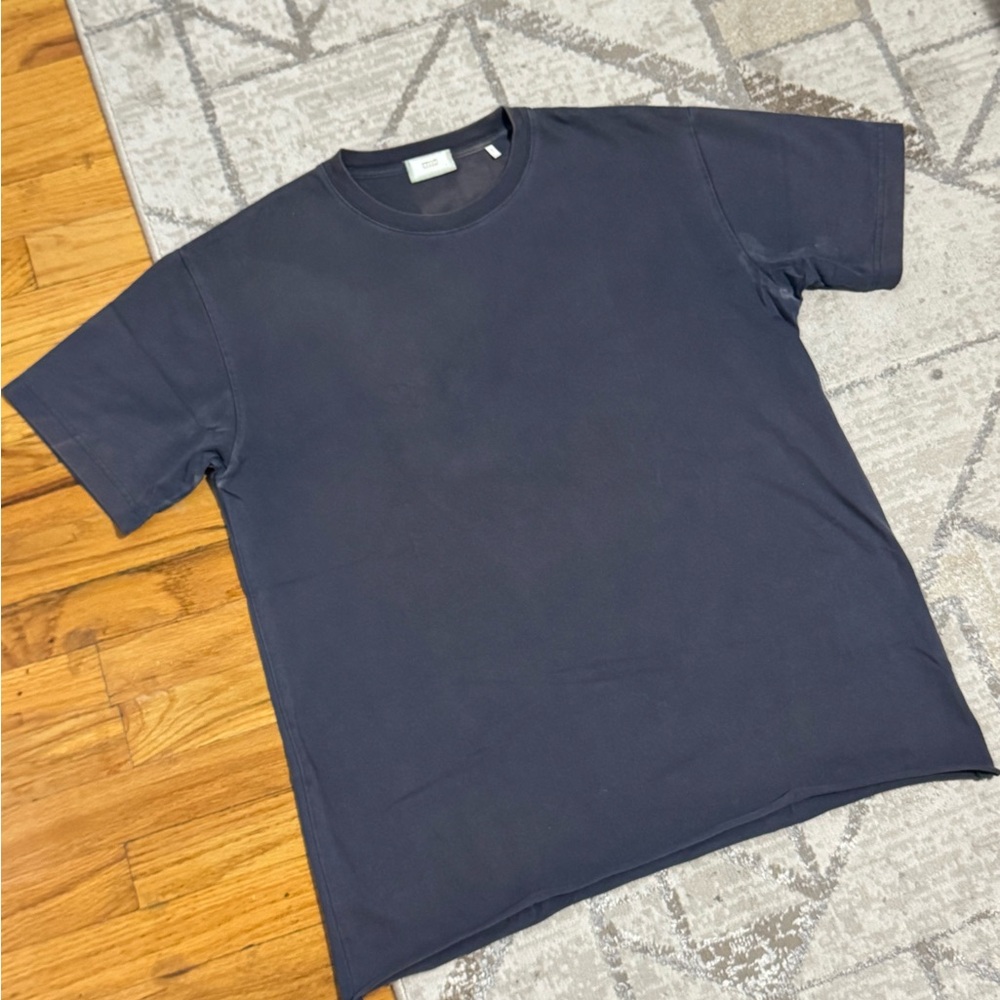 Kith Navy blue tee with a unique, distressed look